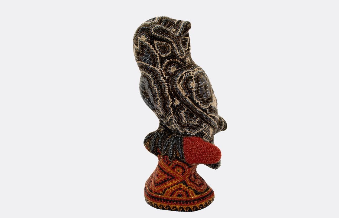 Stunning beautiful huichol art sculpture of an owl perched.